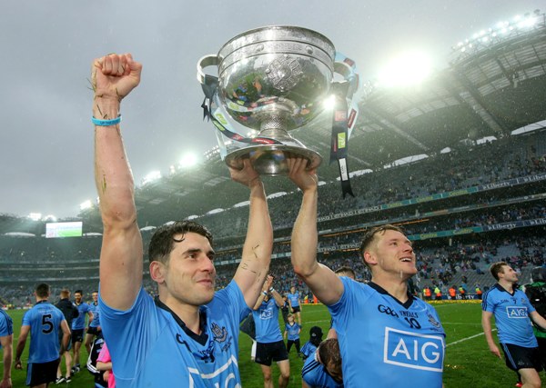 Dublin's Bernard Brogan and Paul Flynn celebrates with the Sam Maguire trophy after the 2015 final. (INPHO/Ryan Byrne)