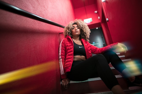 model wearing a red adidas originals puffy jacket